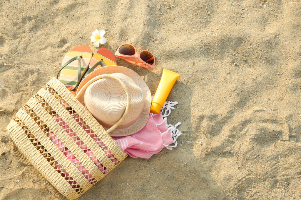 Beach bag spilled across the sand