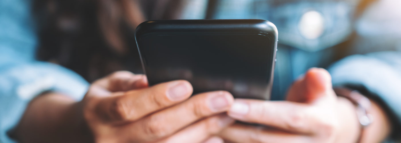 Close up of person holding a smartphone