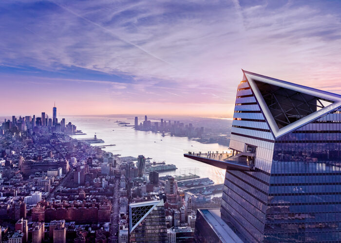 The Edge in New York City at sunset, set against the New York City skyline