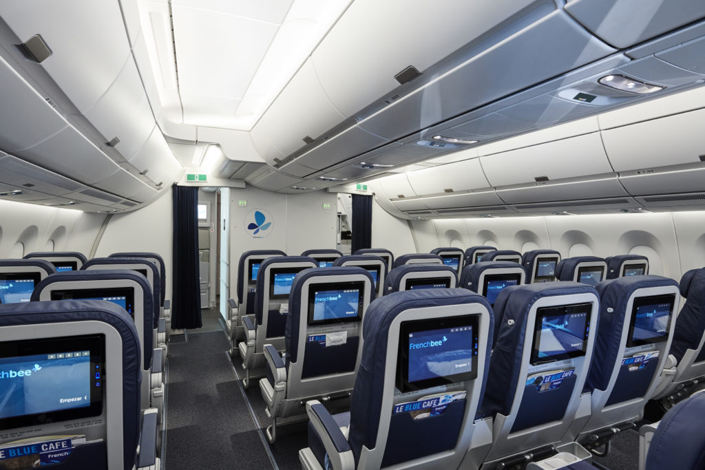 Empty Premium Economy cabin on a French bee plane