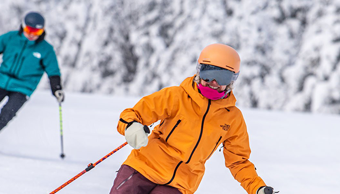 Two people skiing down Stratton Mountain